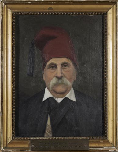 Προσωπογραφία του Ηλία Ιω. Μανωλάκη, ελαιογραφία σε μουσαμά του Ε. Πανταζόπουλου.
