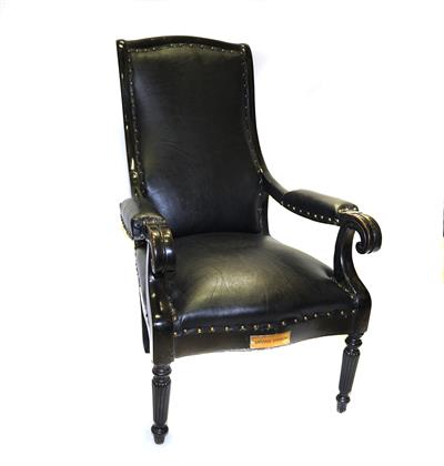 Wooden armchair of prime minister Charilaos Trikoupis, upholstered in black leather