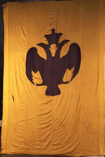 Byzantine Pennant reproduction with a black double-headed eagle and a crown. Similar banners were raised at the Ecumenical Patriarchate of Constantinople when they welcomed the Greek Commander of Smyrna, L. Paraskevopoulos, in March 1919. It belonged to C