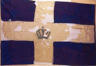 The Greek flag that was raised at Firkas Fortress in Chania in July 1909, when Crete declared the Union with Greece. In August 1909 the consuls of the Great Powers decided the lowering of the flag and a naval contingent cut off the flagpole.
