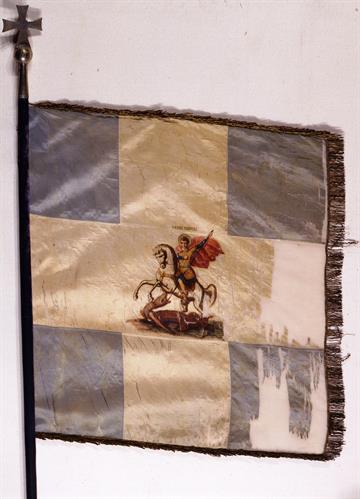 Blue and White war flag of the 2/39 Evzones Regiment. It bears a representation of St. George in the center of the cross.