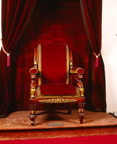 The throne of king Otto and George I. It bares velvet upholstery and woodcut decoration