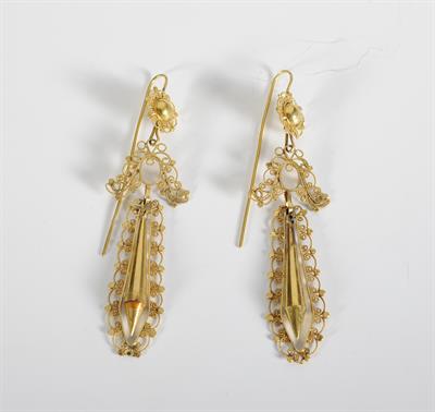 Earrings from Lefkada island. It is decorated with rosette, stylised bow, sword-shaped ornament and floral designs. It has been made with the cast and filigree technique.