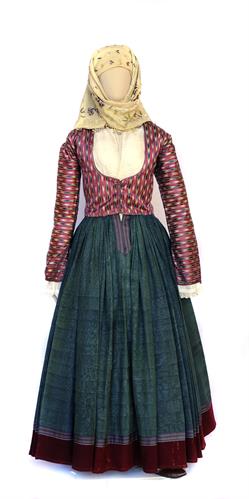 Traditional costume from Hydra island. It consists of a silk tunic, a pleated silk dress, a silk &quot;tzaka&quot; (vest) and a yellow embroidered silk scarf. The dress and vest belonged to Stamatina Kountourioti, wife of Lazaros Kountouriotis, 19th century.