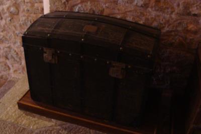 Wooden chest with metal frame. It bares the inscription «D. Boudouris», Lazaros Koundouriotis Historic Residence on Hydra Island
