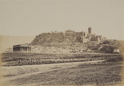 Northwest view of the Temple of Hephaestus and the Acropolis from the Hill of the Nymphs in Athens. In the foreground the Apostolou Pavlou (St Paul&#039;s) street, created in 1860. Photograph by Konstantinou, 1865.