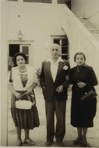 Phroso Koundourioti, Pantelis Koundouriotis and Yioula Koundourioti - Katraki in front of Lazaros Koundouriotis Historic Residence on Hydra Island. Photographic copy, 1956-1957.