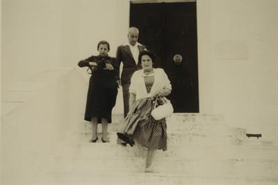 Phroso Koundourioti, Pantelis Koundouriotis and Yioula Koundourioti - Katraki in front of Lazaros Koundouriotis Historic Residence on Hydra Island. Photographic copy, 1956-1957.