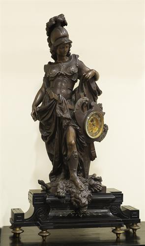 French mantel clock made of brass. It bears on a marble base the sculptural composition of Goddess Athena, work of the French sculptor Frederic Eugene Piat. It belonged to the collection of the King George&#039;s museum, c. 1867.