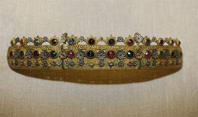 &quot;Korona&quot;, bridal jewelry headband from Thrace. Curved cast gilded plaques forming semicircle and bearing insets casting flowers, enamel and multi-colored stones. On the top, it is decorated with crowns, arrows and crosses.