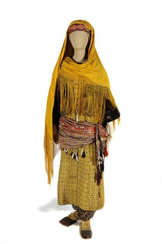 Bridal costume from Kastellorizo. It consists of the breeches (&quot;kontovratsi&quot;), a silk tunic, a straight open-fronted gown (&quot;kavadi&quot;), a silk girdle wound round the waist, a velvet waistcoat trimmed with fair (&quot;kontochi&quot;). The costume is completed by knitt