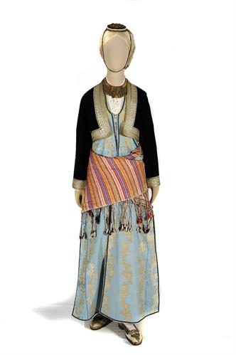Noblewoman&#039;s costume from the Pontus region, Giresun. It consists of a silk tunic with fine lace, blue silk breeches, a long stright open-fronted gown (&quot;kavadi&quot;) and a silver decorated black velvet waistcoat (&quot;zipouni&quot;). The waist is bound with a silk gir
