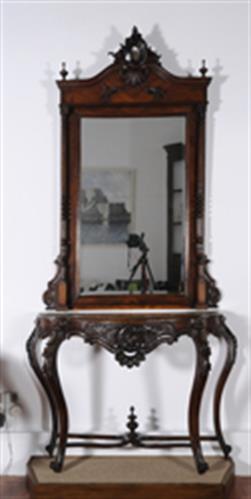 Wooden console table and big mirror. They both bare woodcut decoration, Lazaros Koundouriotis Historic Residence on Hydra Island